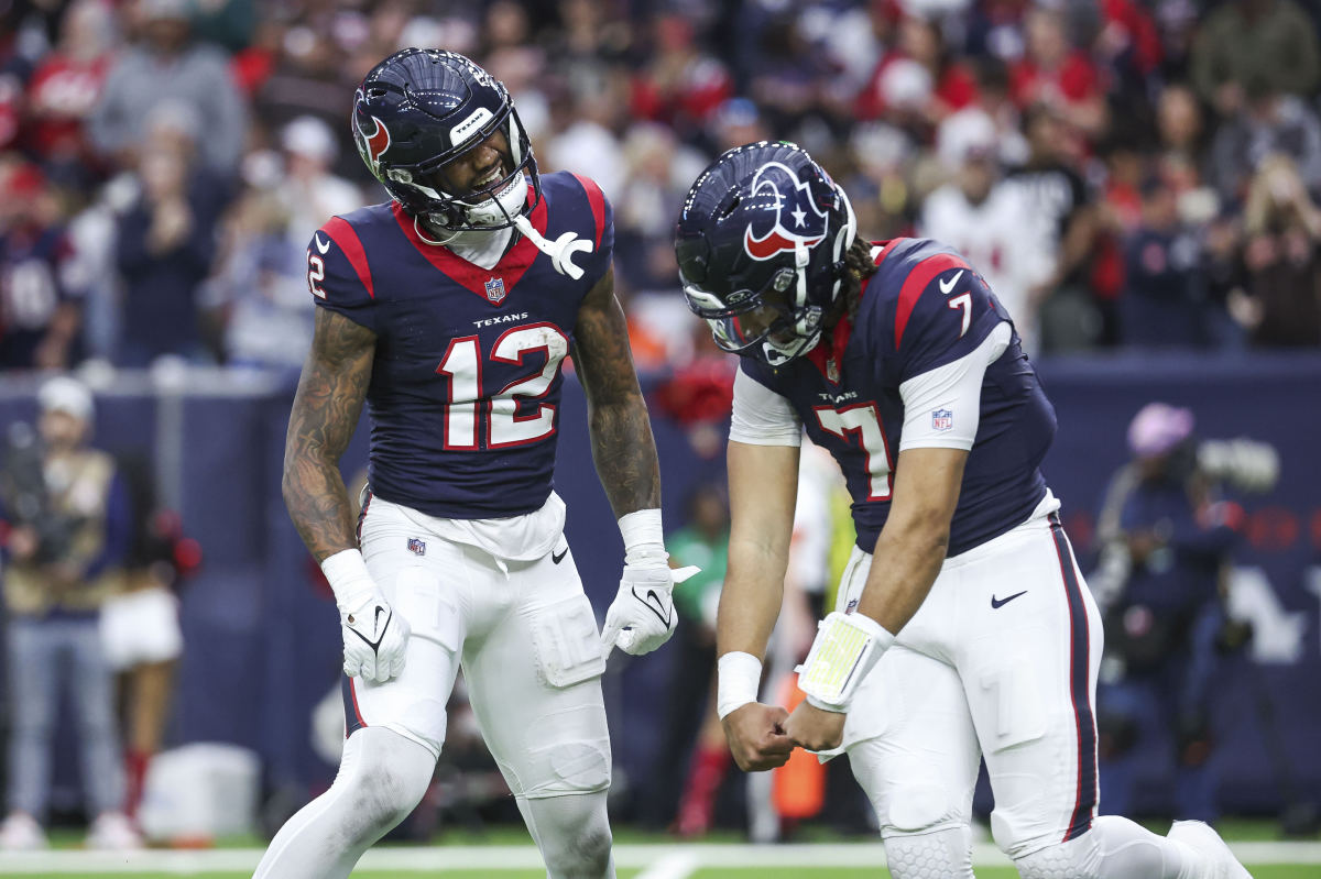Nico Collins and C.J. Stroud dance together in celebration